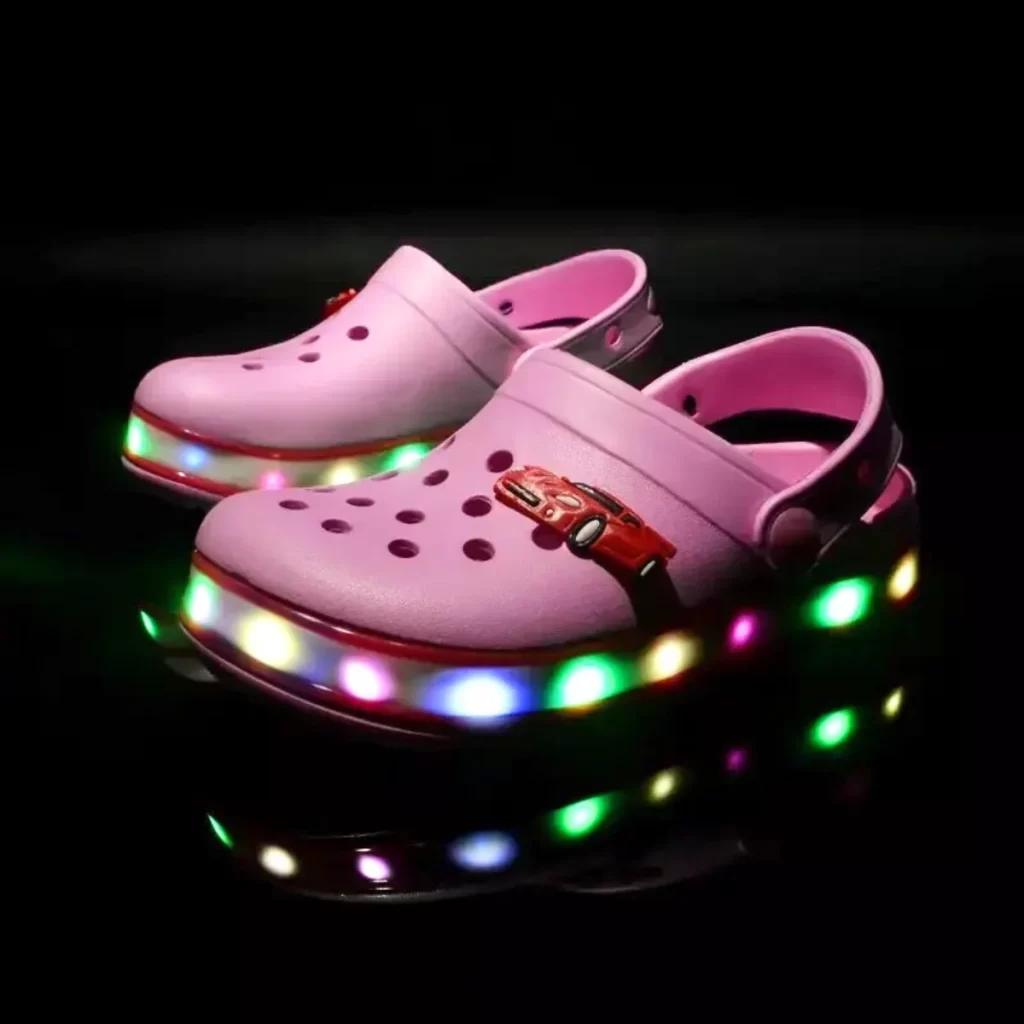 Kids' Pink LED Slides: Fun and comfortable slides featuring built-in LED lights, perfect for adding a touch of sparkle to every step. The vibrant pink color and easy slip-on design make these slides both stylish and practical for active kids