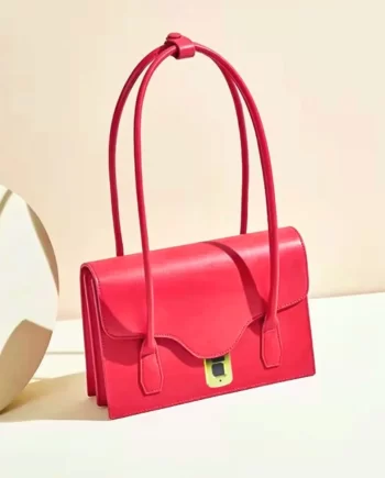 Scarlet Elegance Handbag: A vibrant red handbag featuring a sleek design, gold-toned clasp, and a patterned fabric handle, embodying elegance and style.