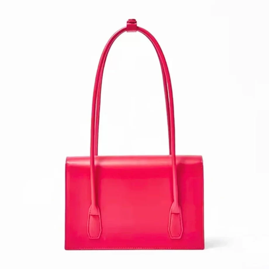 Scarlet Elegance Handbag: A vibrant red handbag featuring a sleek design, gold-toned clasp, and a patterned fabric handle, embodying elegance and style.