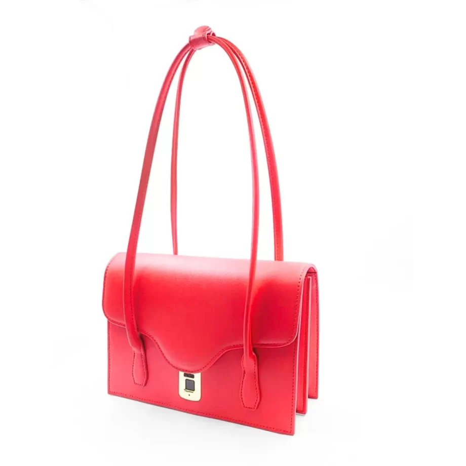 Scarlet Elegance Handbag: A vibrant red handbag featuring a sleek design, gold-toned clasp, and a patterned fabric handle, embodying elegance and style.